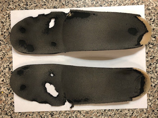 Worn orthotic top covers brought in by a customer